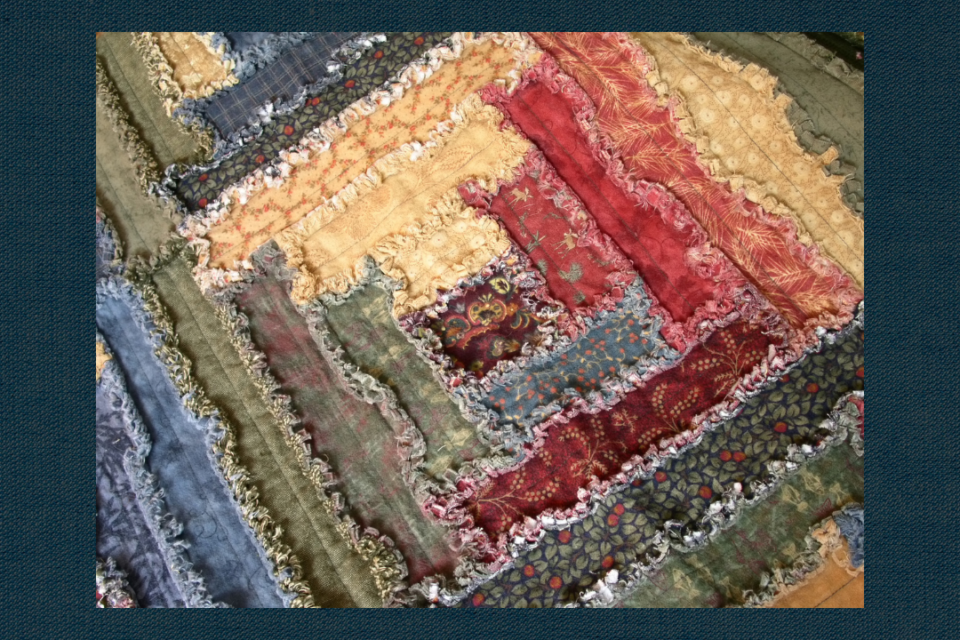 A close up of the fabric on a quilt